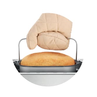 Gloved hand holding the bread pan