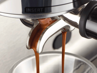 Coffee dripping into a glass