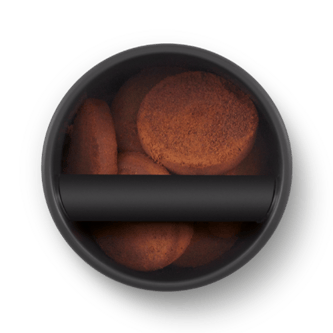 Ariel view of espresso ground pucks in the knock box 10