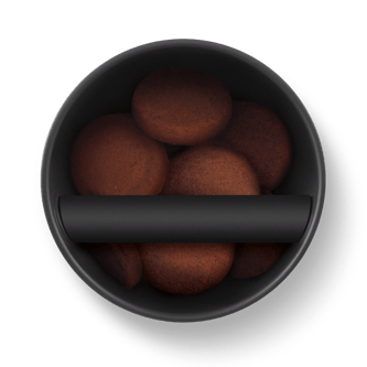 Ariel view of espresso ground pucks in the knock box 20