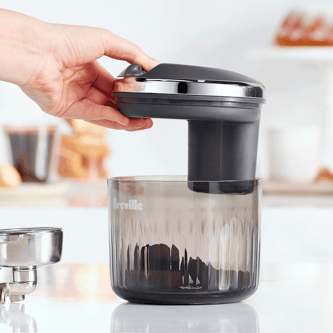 Top cap removeable to extract the used pucks.