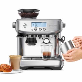 the Barista Pro™ with milk jug, coffee and pastries.