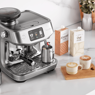 The Oracle Jet with lattes and Almond and Oat milk cartons
