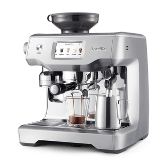 the Oracle® Touch right profile with latte glass and milk jug