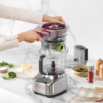 The storage caddy being stored in the food processor bowl