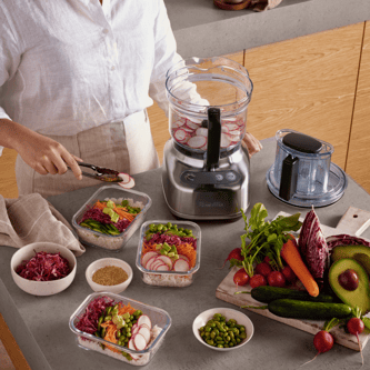 Sliced radishes in the food processor bowl prepared for meals