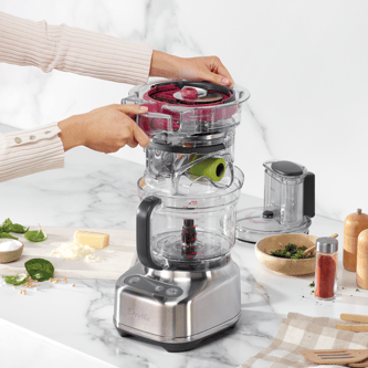 The integrated storage caddy being placed inside the paradice 9 bowl