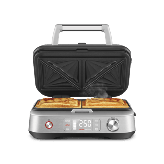 Front view of the Switch & Press™ 3-in-1 with lid open and grilled toastie inside