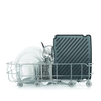 Removable cooking plates placed in a dishwasher.