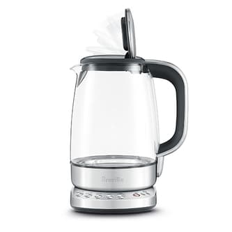 Side view of kettle showing the lid opening slowly.