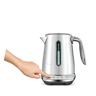 Side view of kettle with hand selecting button.