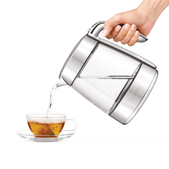 The smart crystal luxe kettle being poured into cup with tea
