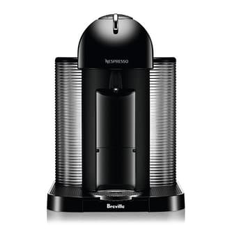 Front view of machine with cup of coffee.