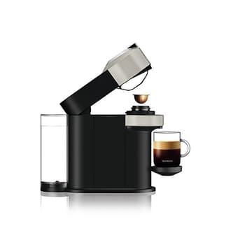 Side view of machine with the coffee cup and capsules