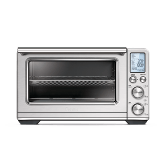 The Smart Oven Air Fryer XL with a roast chicken