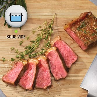 Steak sliced open to show perfect medium rare doneness.