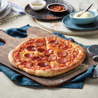 Toppings and cheese on the pizza