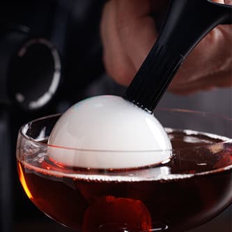 Bubble on top of a cocktail glass