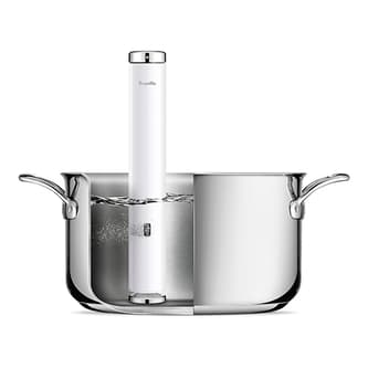 The Joule Turbo Sous Vide inside a pan filled up with water