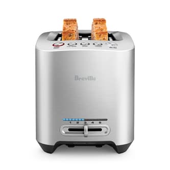 View of thickly sliced bread fitting in toaster with wider slots.