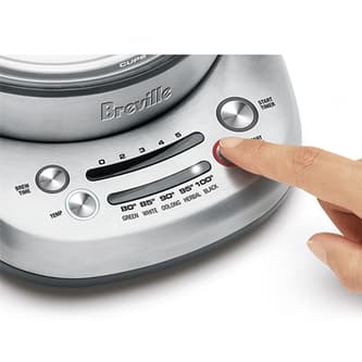 View of kettle with person selecting steep button.