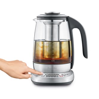 View of kettle with person selecting steep button.