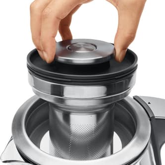 Top view of kettle with person removing basket.