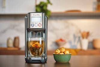 The Aquastation™ Purifier Hot and a cup of tea