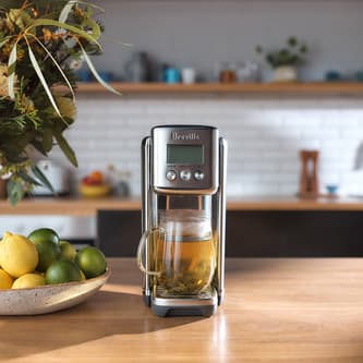 The Aquastation™ Purifier Hot with a cup of tea