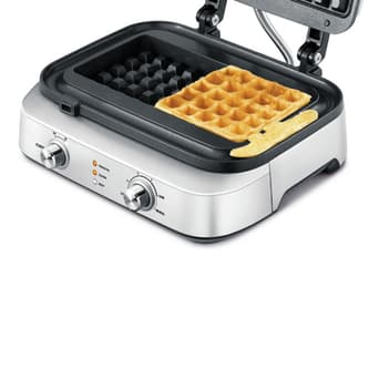 Waffle maker with no spillage out of cooking plates.