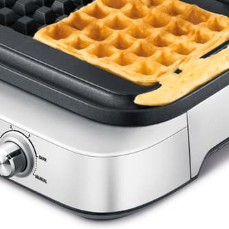 Waffle maker with no spillage out of cooking plates.