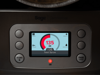 The LED screen on the precision cooker shows the temperature of the spices being toasted in the pot.