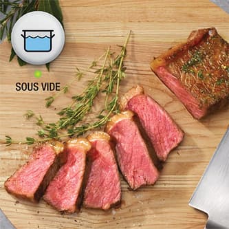 Steak sliced open to show perfect medium rare doneness.