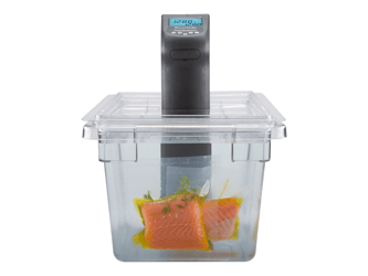 The sous vide device sits within a large container of water with sealed salmon.