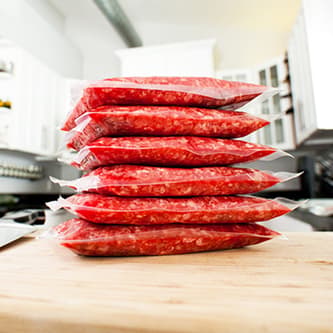 Vacuum sealed produce stacked on top of one another.