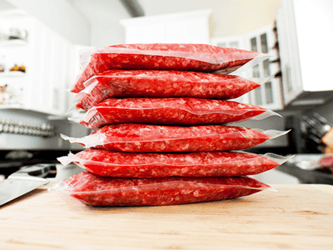 Vacuum sealed produce stacked on top of one another.