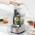 Sliced cucumbers in the food processor bowl