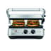 Two sandwiches being pressed in the grill.