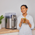 Lifestyle image of woman holding iced tea