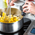 Person adjusting temperature dial of the precision cooker.